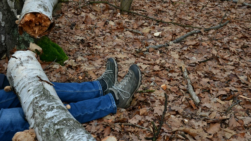 Legs crushed under fallen log